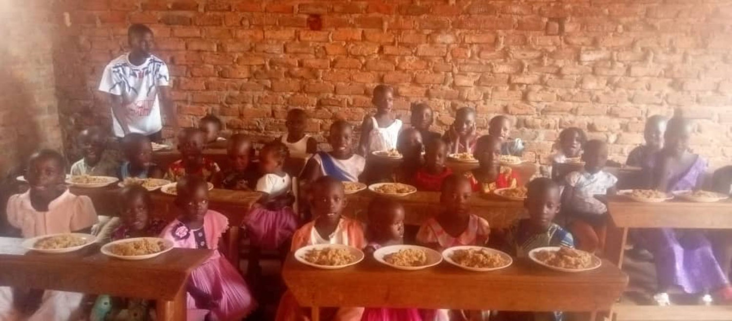 Children sharing a meal during the first programme